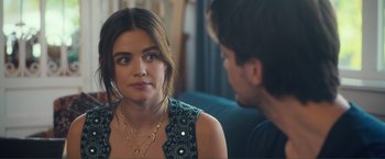 Movie still from “Puppy Love” (2023), directed by Richard Alan Reid – A man and a woman sitting in front of each other on a couch; Close Up shot, Over the shoulder angle