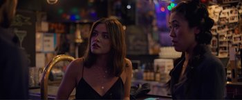 Movie still from “Puppy Love” (2023), directed by Richard Alan Reid – A woman sitting at a table in front of another woman; Close Up shot, Over the shoulder angle