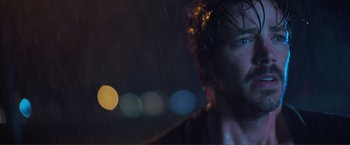 Movie still from “Puppy Love” (2023), directed by Richard Alan Reid – A person with a beard in the rain; Extreme Close Up shot, Low angle