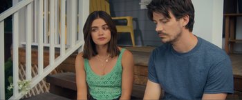 Movie still from “Puppy Love” (2023), directed by Richard Alan Reid – A young woman sitting next to a young man on a porch; Close Up shot, Over the shoulder angle
