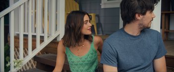 Movie still from “Puppy Love” (2023), directed by Richard Alan Reid – A woman sitting next to a man on a porch; Close Up shot, Over the shoulder angle