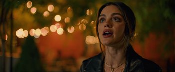 Movie still from “Puppy Love” (2023), directed by Richard Alan Reid – A beautiful young lady wearing a black leather jacket; Close Up shot, Over the shoulder angle