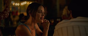 Movie still from “Puppy Love” (2023), directed by Richard Alan Reid – A beautiful young lady sitting at a table in a restaurant; Close Up shot, Over the shoulder angle