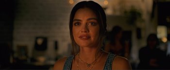 Movie still from “Puppy Love” (2023), directed by Richard Alan Reid – A person wearing a necklace; Close Up shot, Over the shoulder angle