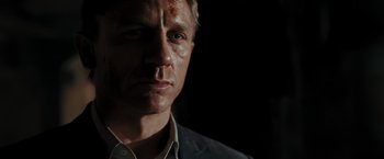 Movie still from “Quantum of Solace” (2008), directed by Marc Forster – A person wearing a jacket; Close Up shot, Low angle