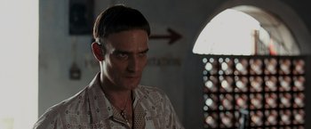 Movie still from “Quantum of Solace” (2008), directed by Marc Forster – A person wearing a shirt; Close Up shot, Low angle