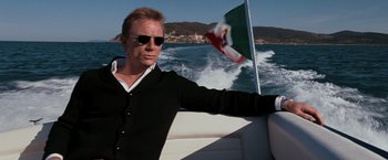 Movie still from “Quantum of Solace” (2008), directed by Marc Forster – A man on a boat in the water; Medium shot, Low angle