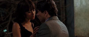 Movie still from “Quantum of Solace” (2008), directed by Marc Forster – A man and a woman standing next to each other; Close Up shot, Over the shoulder angle