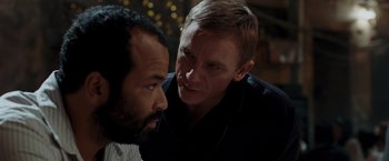 Movie still from “Quantum of Solace” (2008), directed by Marc Forster – A man and a man talking to each other; Close Up shot, Over the shoulder angle