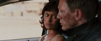 Movie still from “Quantum of Solace” (2008), directed by Marc Forster – A man and a woman sitting in a car; Close Up shot, Over the shoulder angle