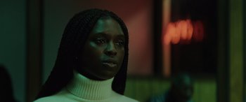 Movie still from “Queen & Slim” (2019), directed by Melina Matsoukas – A person wearing a white sweater; Close Up shot, Low angle