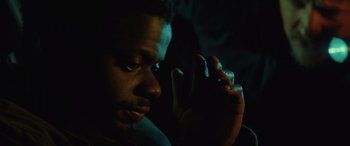 Movie still from “Queen & Slim” (2019), directed by Melina Matsoukas – A person holding something in his hand; Close Up shot, High angle