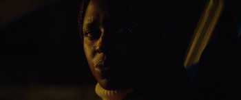 Movie still from “Queen & Slim” (2019), directed by Melina Matsoukas – A person's face in the dark; Close Up shot, Low angle
