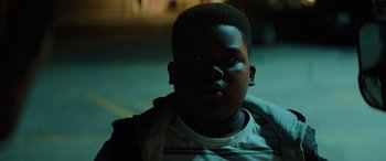 Movie still from “Queen & Slim” (2019), directed by Melina Matsoukas – A young black man is looking into the camera; Close Up shot, High angle