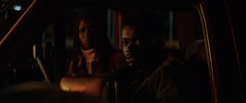 Movie still from “Queen & Slim” (2019), directed by Melina Matsoukas – Two people sitting in a car at night; Close Up shot, Over the shoulder angle