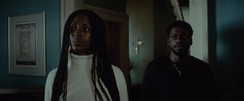 Movie still from “Queen & Slim” (2019), directed by Melina Matsoukas – A man and a woman standing next to each other in a room; Close Up shot, Low angle
