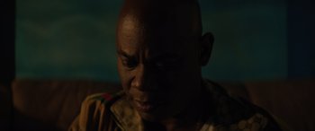 Movie still from “Queen & Slim” (2019), directed by Melina Matsoukas – A man's face in the dark; Close Up shot, Low angle