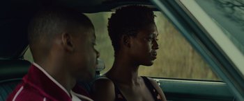 Movie still from “Queen & Slim” (2019), directed by Melina Matsoukas – A man and a woman sitting in the back of a car; Close Up shot, Over the shoulder angle