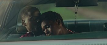Movie still from “Queen & Slim” (2019), directed by Melina Matsoukas – A man and a woman in a car with their heads resting on the steering wheel; Close Up shot, High angle