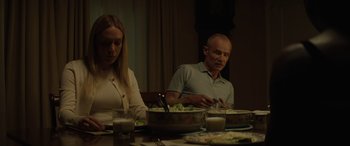 Movie still from “Queen & Slim” (2019), directed by Melina Matsoukas – A man and a woman sitting at a dinner table; Medium shot, Low angle