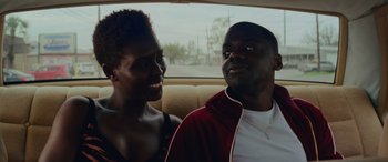 Movie still from “Queen & Slim” (2019), directed by Melina Matsoukas – A man and a woman sitting in the back of a car; Close Up shot, Over the shoulder angle