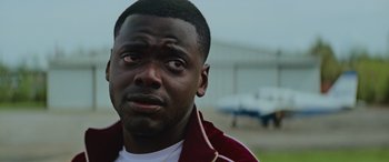 Movie still from “Queen & Slim” (2019), directed by Melina Matsoukas – A person wearing a jacket; Close Up shot, Over the shoulder angle