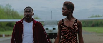 Movie still from “Queen & Slim” (2019), directed by Melina Matsoukas – A man and a woman walking down a street; Medium shot, Low angle