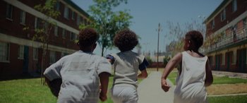 Movie still from “Queen & Slim” (2019), directed by Melina Matsoukas – A couple of people that are walking down a street; Close Up shot, Low angle