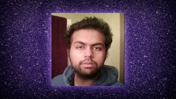 Movie still from “Queenmaker: The Making of an It Girl” (2023), directed by Zackary Drucker – A man with a beard is looking at the camera; Medium shot, Low angle