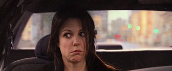 Movie still from “RED” (2010), directed by Robert Schwentke – A person sitting in a car; Close Up shot, Over the shoulder angle