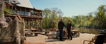 Movie still from “RED” (2010), directed by Robert Schwentke – A man and a woman standing next to each other; Wide shot, Over the shoulder angle