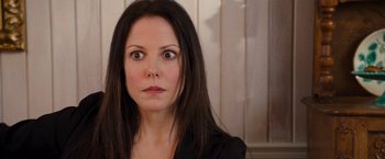 Movie still from “RED” (2010), directed by Robert Schwentke – A person with long black hair; Close Up shot, Over the shoulder angle