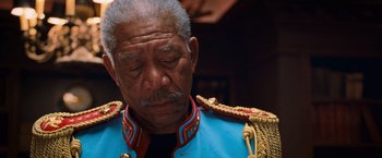 Movie still from “RED” (2010), directed by Robert Schwentke – An older man wearing a blue military jacket; Close Up shot, Low angle
