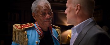 Movie still from “RED” (2010), directed by Robert Schwentke – A man in a military uniform talking to another man in a suit; Close Up shot, Over the shoulder angle