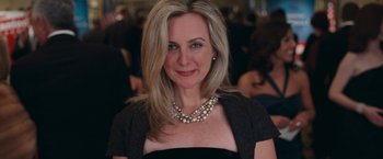 Movie still from “RED” (2010), directed by Robert Schwentke – A person wearing a necklace; Close Up shot, Low angle