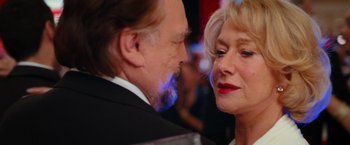 Movie still from “RED” (2010), directed by Robert Schwentke – A man and a woman face to face in front of a crowd; Close Up shot, Over the shoulder angle