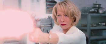 Movie still from “RED” (2010), directed by Robert Schwentke – A woman holding a gun pointed at the camera; Close Up shot, Low angle