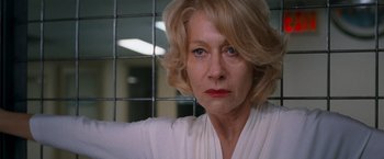 Movie still from “RED” (2010), directed by Robert Schwentke – An older woman with blonde hair and blue eyes; Close Up shot, Low angle