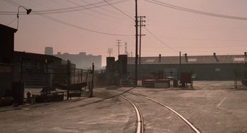 Movie still from “Rain Man” (1988), directed by Barry Levinson – An empty train track in the middle of the day; Extreme Wide shot, High angle