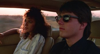 Movie still from “Rain Man” (1988), directed by Barry Levinson – A man and a woman sitting in the back of a car; Close Up shot, Over the shoulder angle