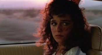 Movie still from “Rain Man” (1988), directed by Barry Levinson – A person sitting in a car; Close Up shot, Over the shoulder angle