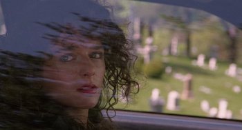 Movie still from “Rain Man” (1988), directed by Barry Levinson – A woman sitting in a car looking out the window; Close Up shot, Low angle
