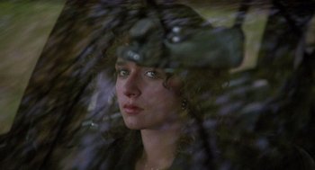 Movie still from “Rain Man” (1988), directed by Barry Levinson – A person holding a umbrella; Close Up shot, Over the shoulder angle