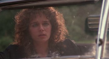 Movie still from “Rain Man” (1988), directed by Barry Levinson – A person looking out a car window; Close Up shot, Over the shoulder angle