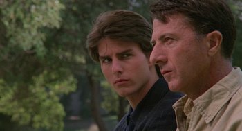 Movie still from “Rain Man” (1988), directed by Barry Levinson – A man and a man standing next to each other; Close Up shot, Over the shoulder angle