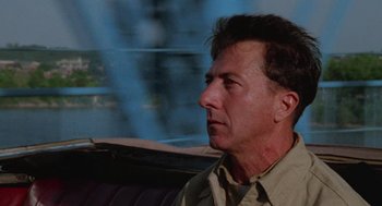 Movie still from “Rain Man” (1988), directed by Barry Levinson – A person sitting in a car; Close Up shot, Over the shoulder angle