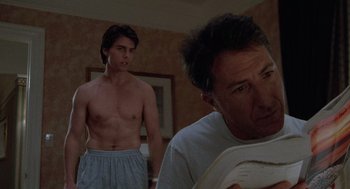 Movie still from “Rain Man” (1988), directed by Barry Levinson – A shirtless man and a man in a white shirt; Medium shot, Low angle