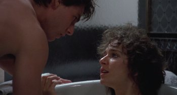 Movie still from “Rain Man” (1988), directed by Barry Levinson – A man and a woman in a bath tub looking into each other's eyes; Close Up shot, Over the shoulder angle