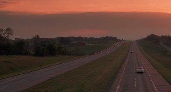 Movie still from “Rain Man” (1988), directed by Barry Levinson – A road with a bunch of cars on the side of the road; Extreme Wide shot, High angle