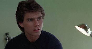 Movie still from “Rain Man” (1988), directed by Barry Levinson – A person wearing a black shirt; Close Up shot, Over the shoulder angle